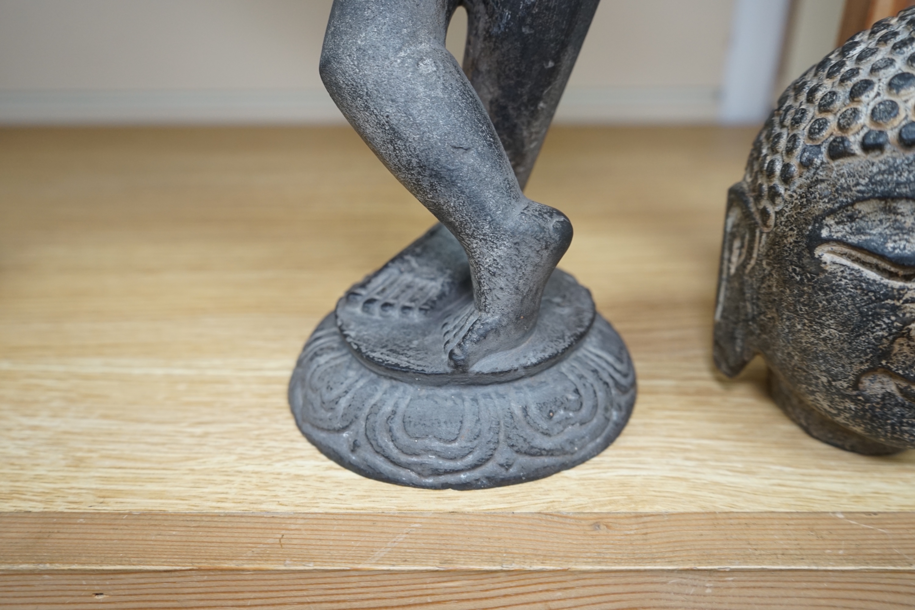 An Indian stone Buddha head and a figural carving, 29cm. Condition - figure repaired